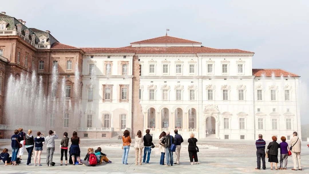 Tourists viewing fountains at Palace of Venaria Reale, a royal residence near Turin, Piedmont.