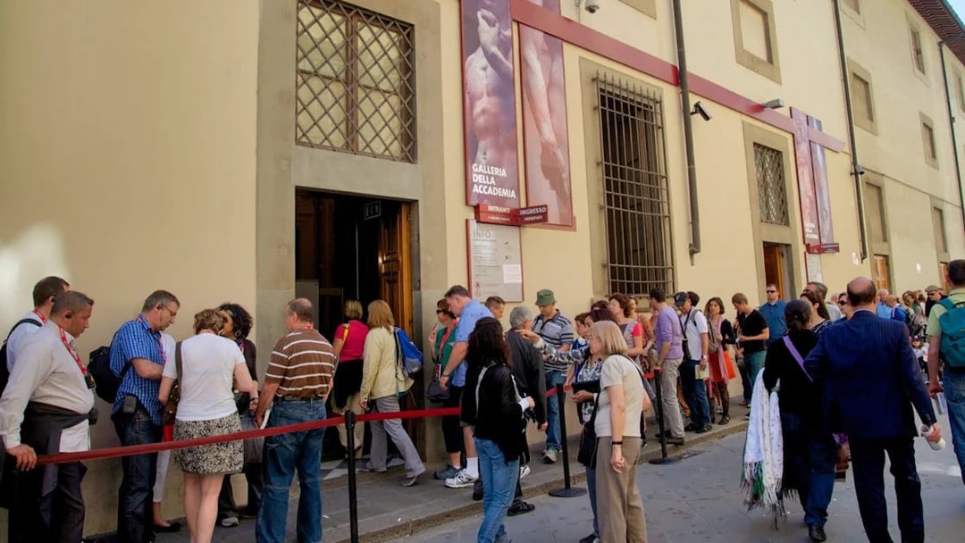 Visitors queuing at the Accademia Gallery entrance in Florence.