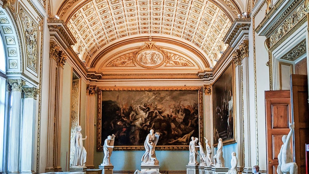 Palazzo Vecchio interior with classical statues and ornate ceiling, Florence.