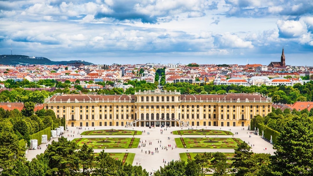 Tourists at Schonbrunn Palace and Gardens, Vienna, on Hop On Hop Off iCity Tour.