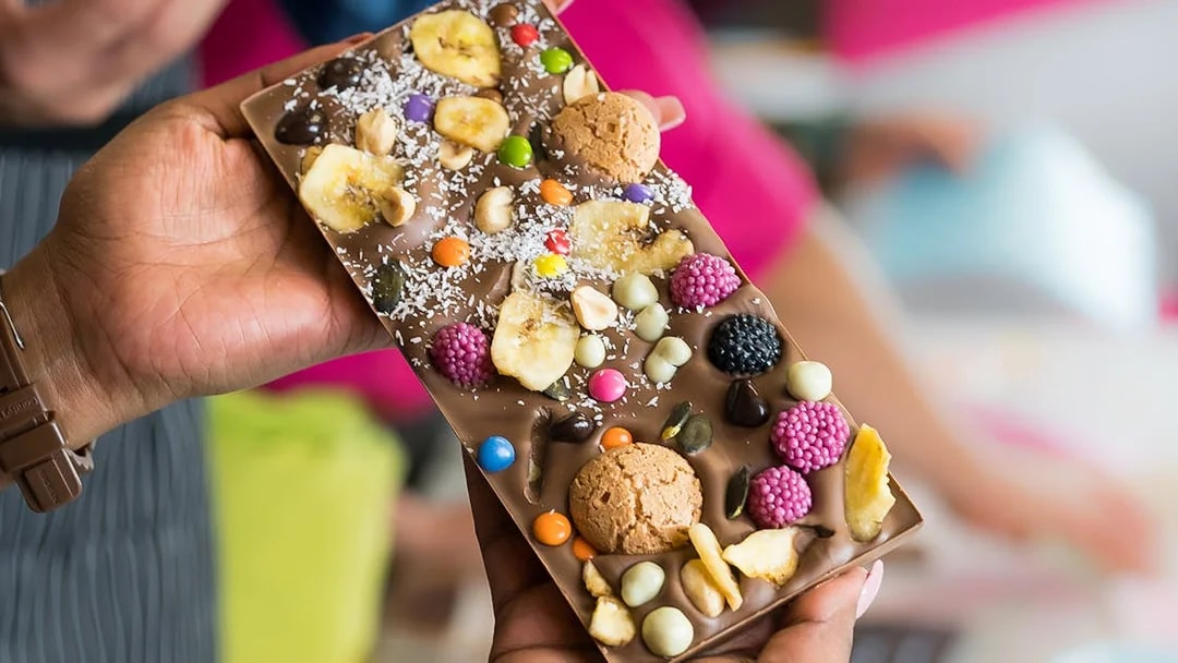 Chocolate bar with assorted toppings at Vienna chocolate workshop.