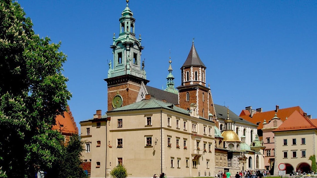 Wawel Cathedral exterior with tourists in Krakow, Poland.