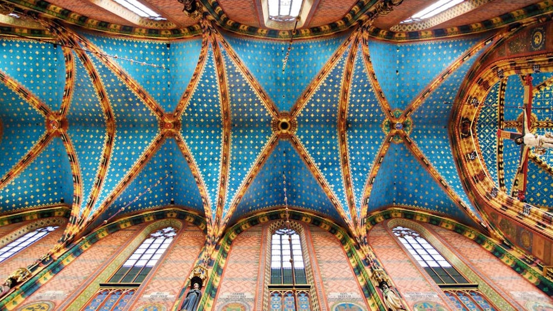 Ceiling of Saint Mary's Basilica in Krakow's Old Town, featuring intricate blue and gold patterns.