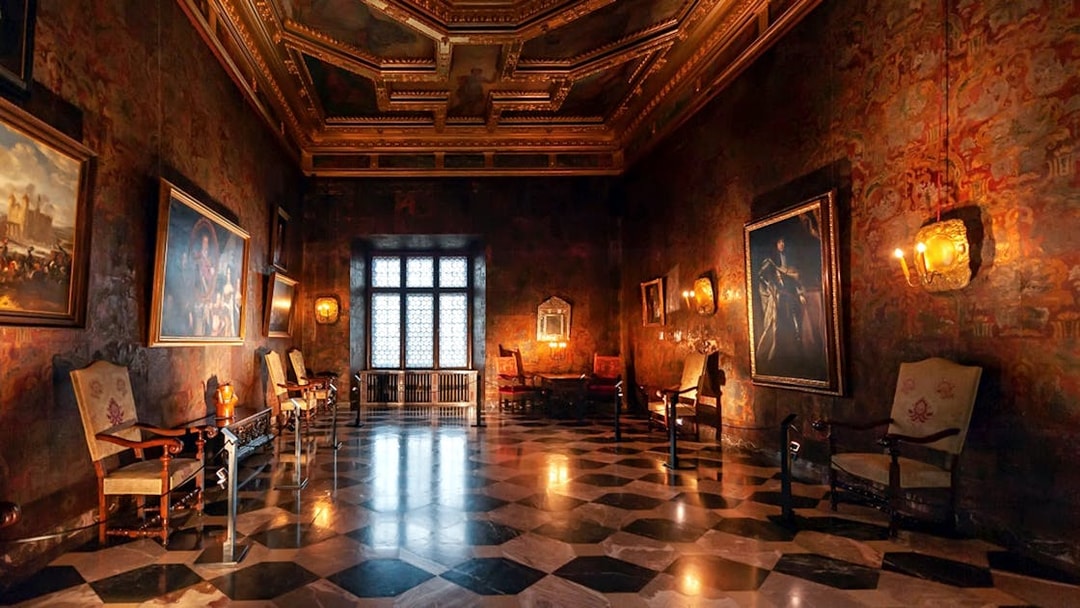 Wawel Castle interior with ornate ceiling and historic paintings, part of guided tour in Krakow.