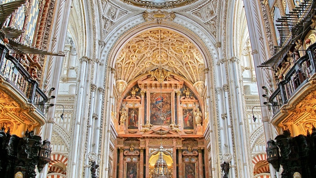 Cordoba Mosque-Cathedral interior with ornate arches and detailed ceiling.
