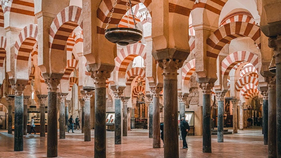 Interior arches of Cordoba Mosque-Cathedral during guided tour.