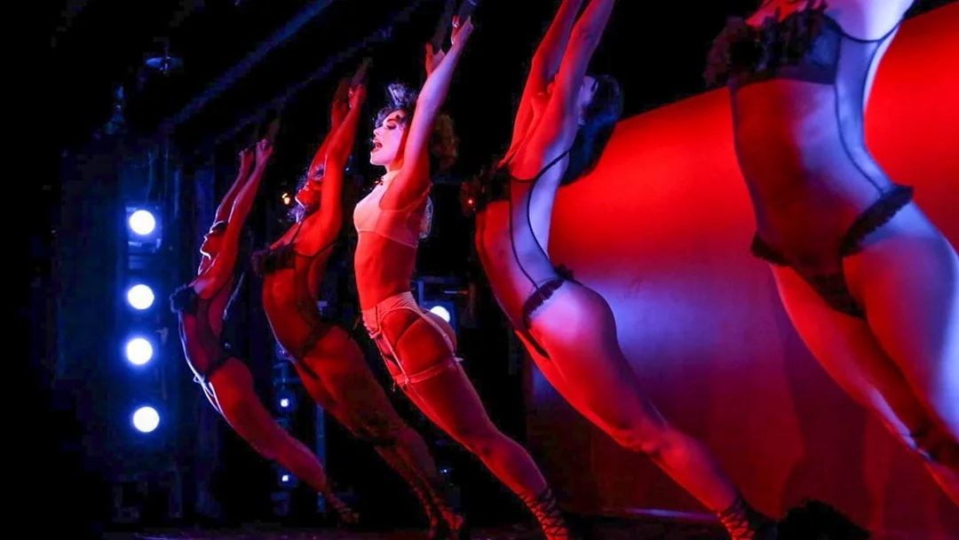 Performers on stage during Crazy Horse Show at Moulin Rouge, Paris.