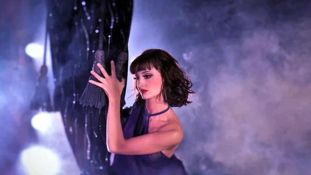 Performer in a dramatic pose at Crazy Horse Paris show.