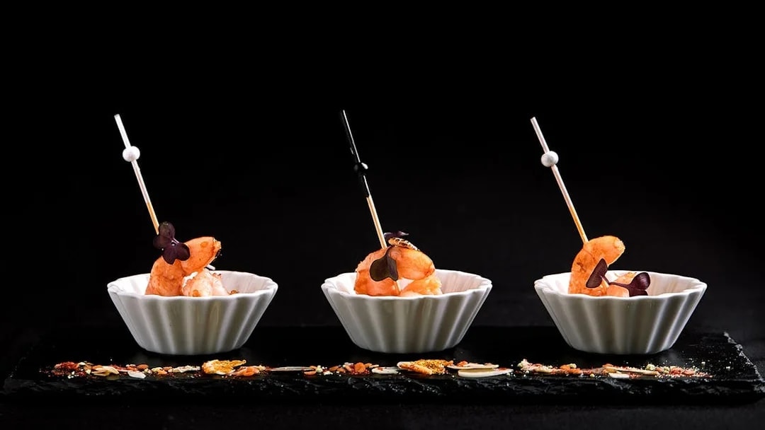 Tiger baby prawns in white bowls at Ginger Restaurant.