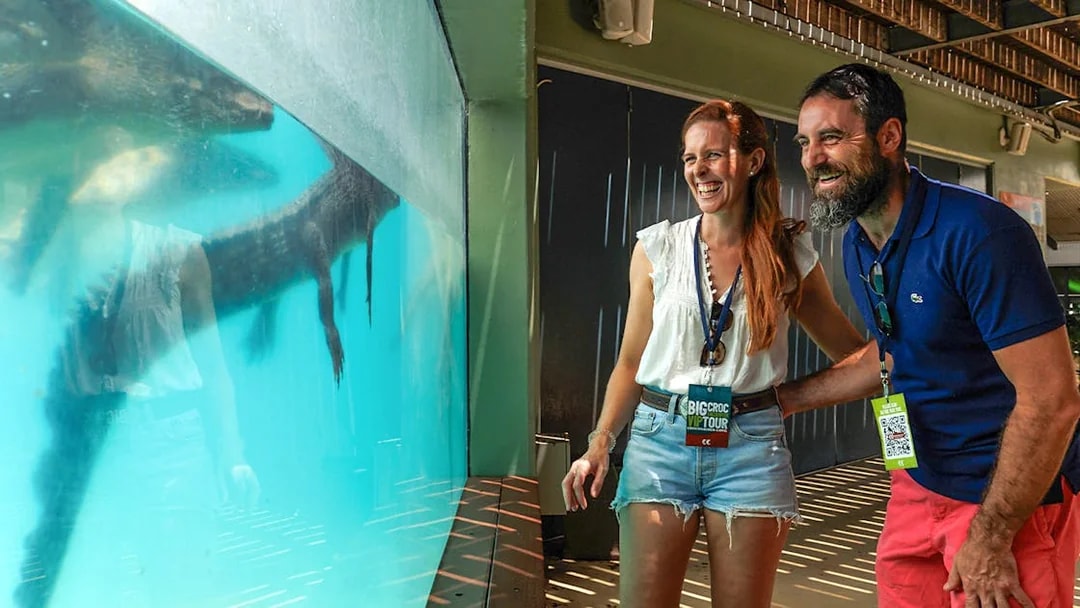 Couple enjoying crocodile view at Crocosaurus Cove, Darwin, Australia.