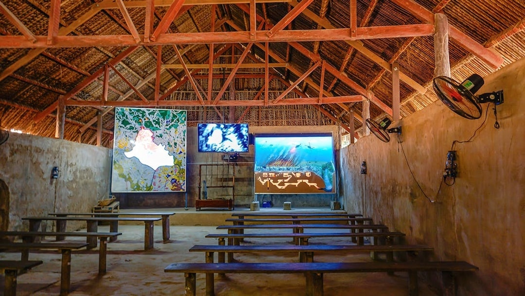 Film room with benches and screens at Cu Chi Tunnels, Vietnam.
