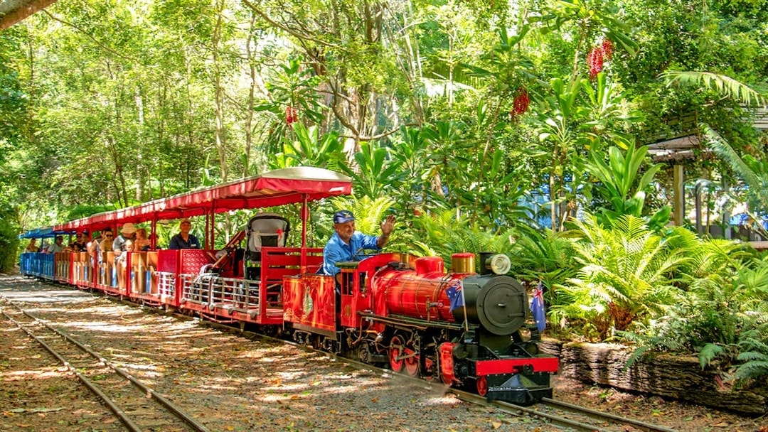 Currumbin Wildlife Sanctuary train ride through lush greenery.