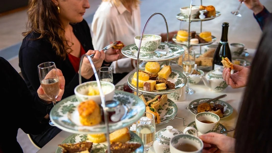 Afternoon tea with pastries and sandwiches at Cutty Sark, London.