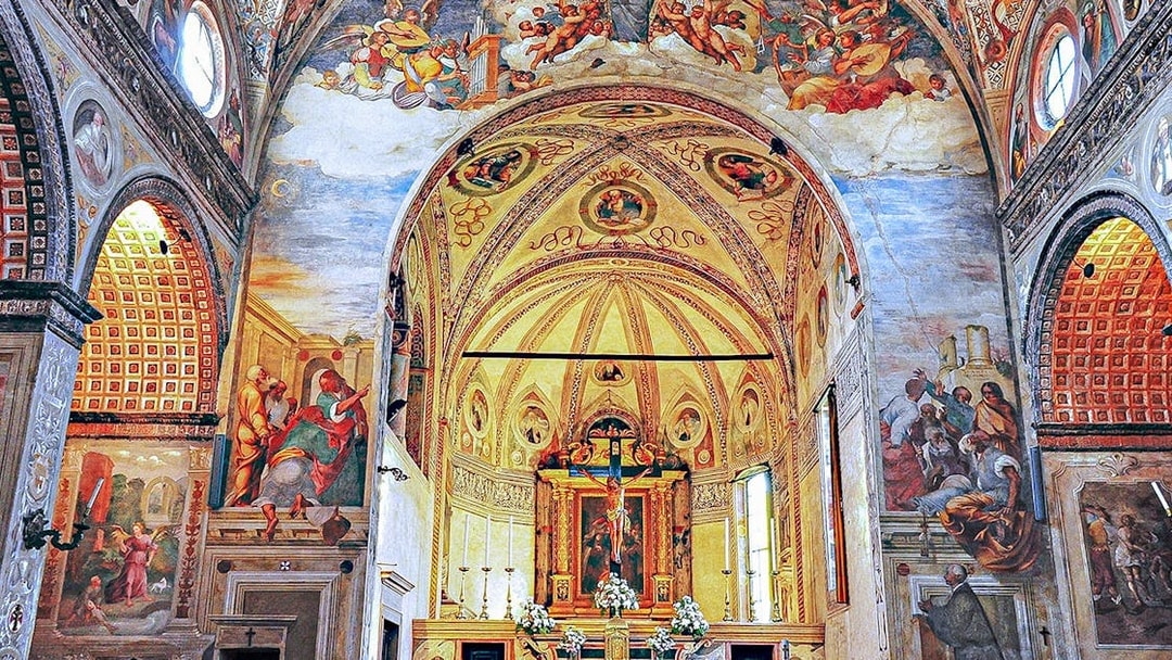 Interior of Santa Maria delle Grazie, Milan, with frescoes and ornate altar.