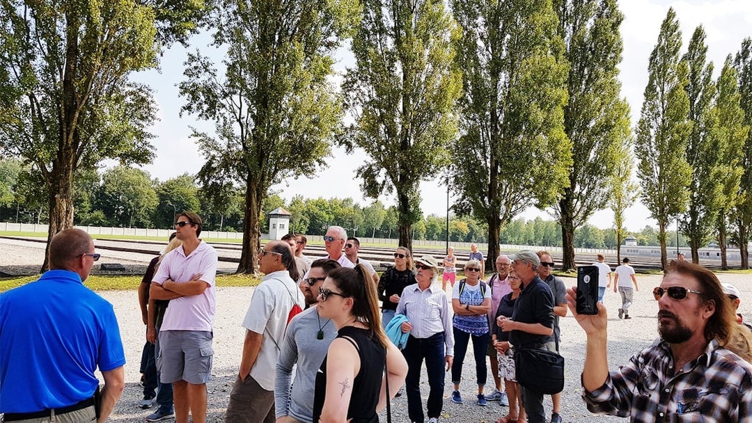 Visitors on a guided tour at Dachau Concentration Camp Memorial Site, Germany.
