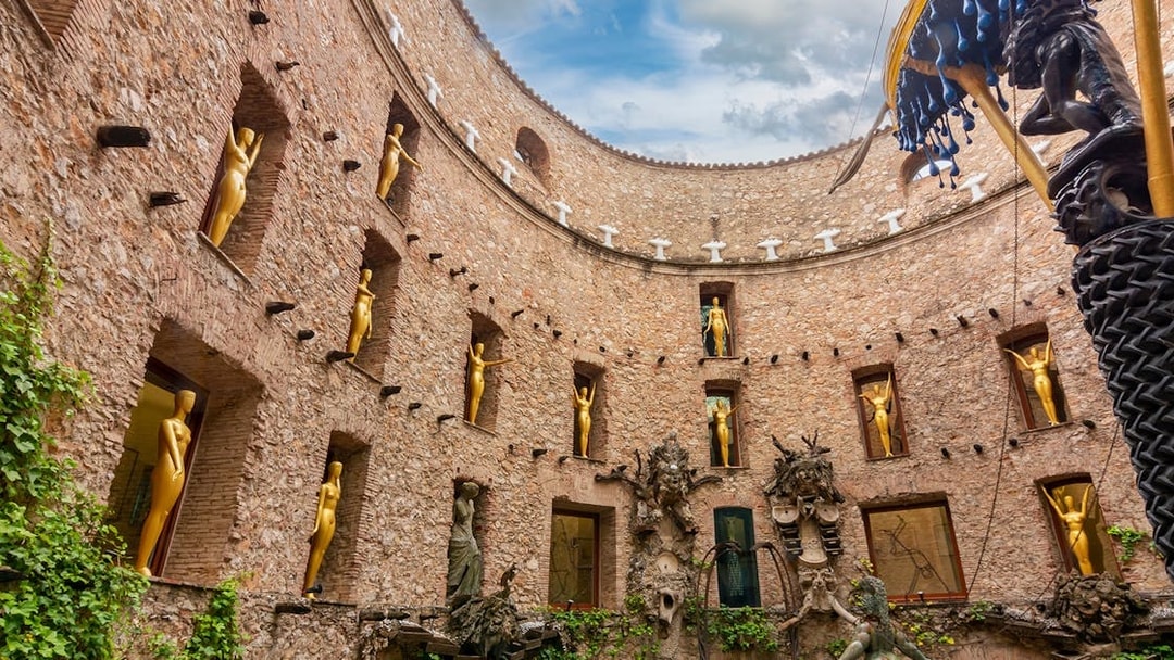 Dali Theatre-Museum courtyard with golden statues, Figueres, Spain.