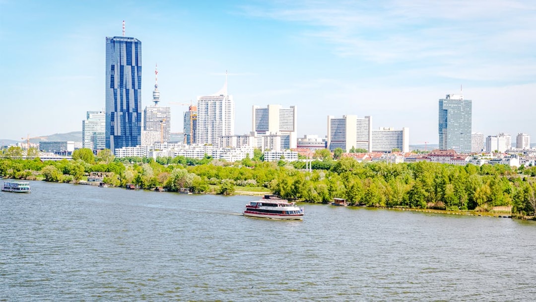 Vienna skyline with Danube River in foreground, Austria.