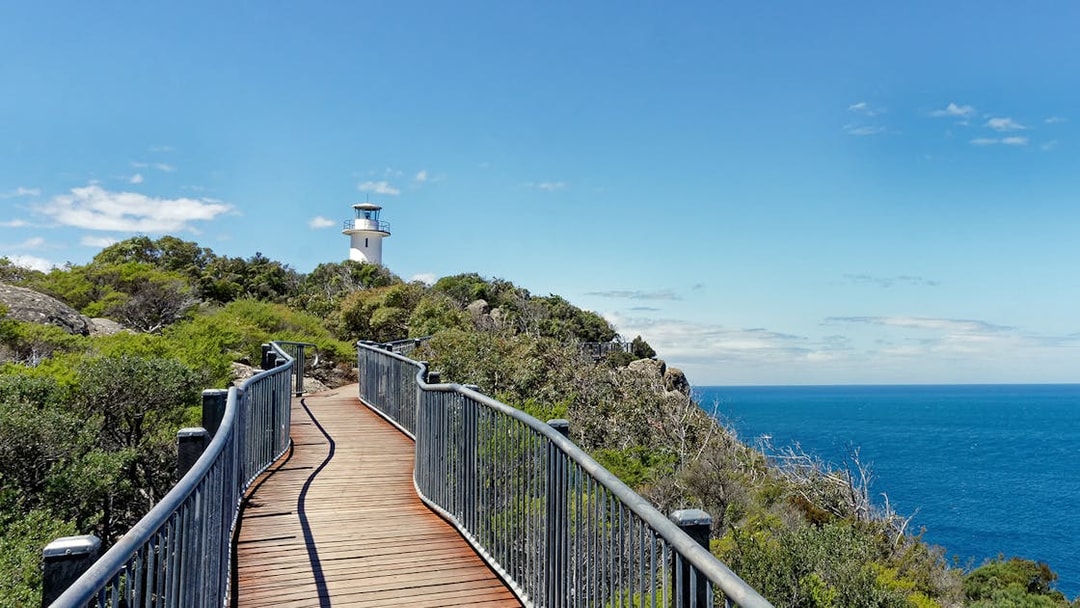 Coastal path leading to a lighthouse near Wineglass Bay, Tasmania.