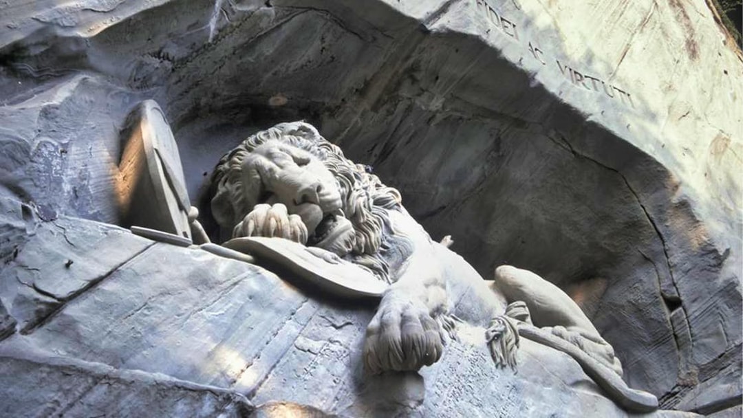 Lion Monument in Lucerne, Switzerland, depicting a dying lion carved into rock.