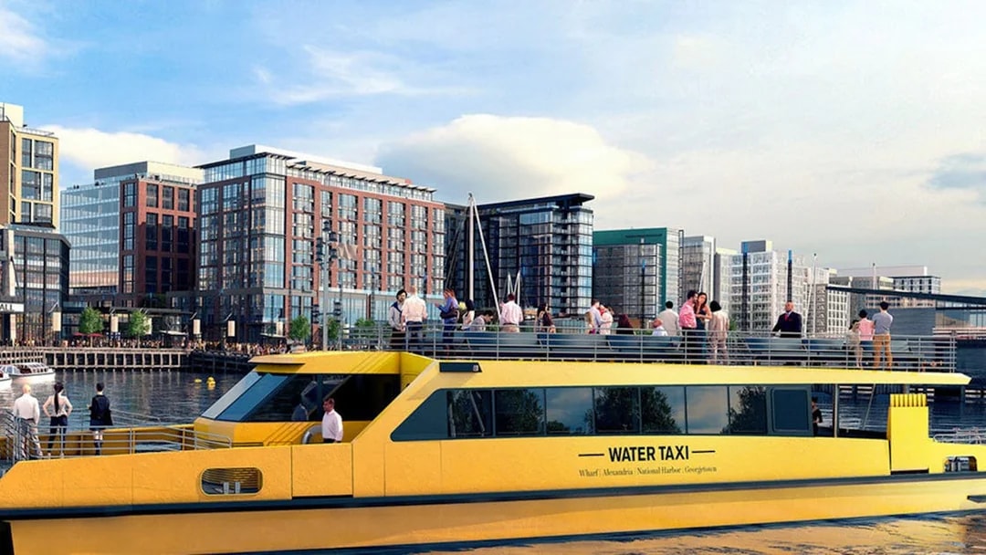 Yellow water taxi on the Potomac River with Washington DC skyline in the background.