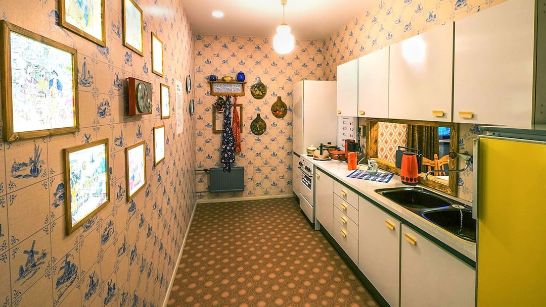 DDR Museum Berlin kitchen exhibit with vintage decor and appliances.