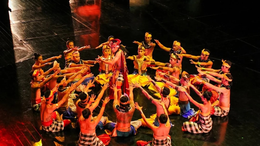 Performers in traditional attire during the Devdan Show in Bali, showcasing cultural dance.