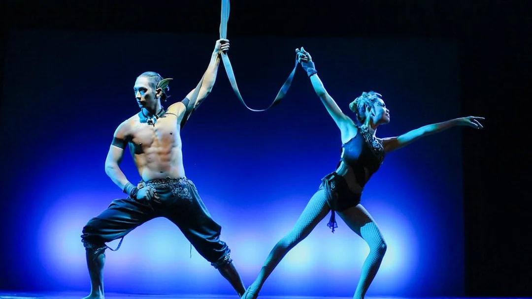 Performers on stage during the Devdan Show in Bali, showcasing a cultural dance.