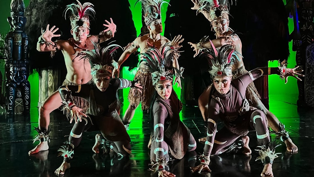 Performers in traditional costumes during the Devdan Show in Bali, showcasing cultural dance.