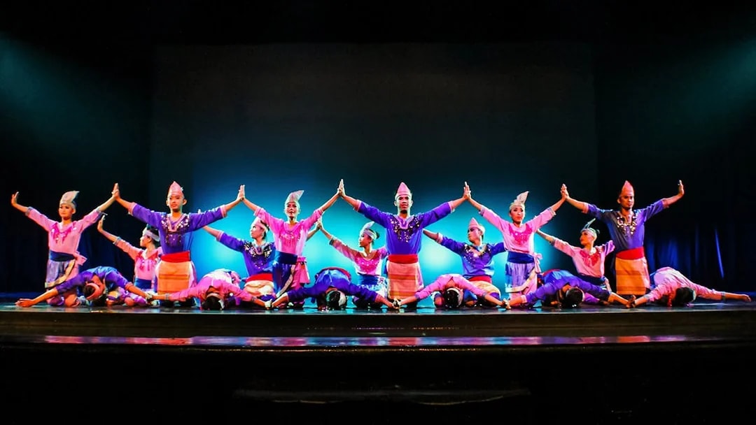 Performers on stage during the Devdan Show in Bali, showcasing a cultural dance.