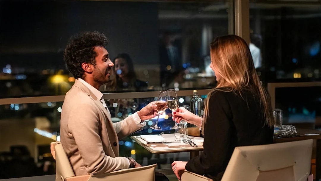 Couple dining at Madame Brasserie, Eiffel Tower, Paris.