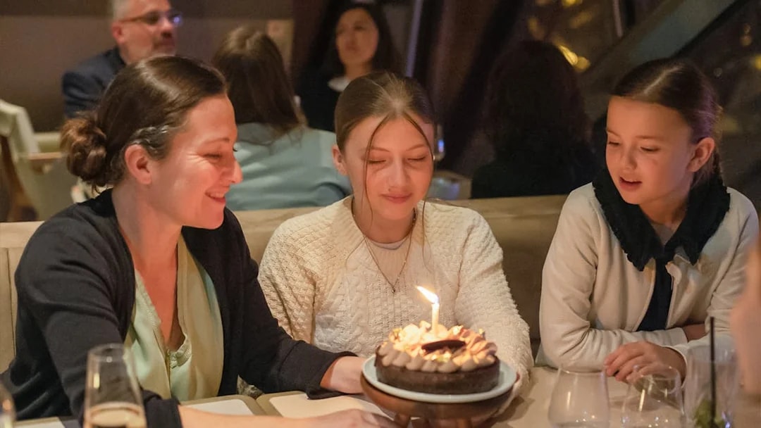 Guests enjoying a birthday celebration at Madame Brasserie, Eiffel Tower.