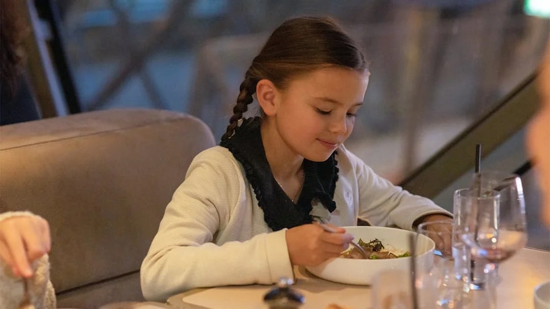 Child dining at Madame Brasserie, Eiffel Tower, Paris.