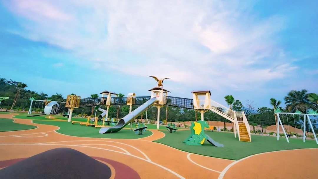 Playground with dinosaur-themed slides and climbing structures at Dino Desert.