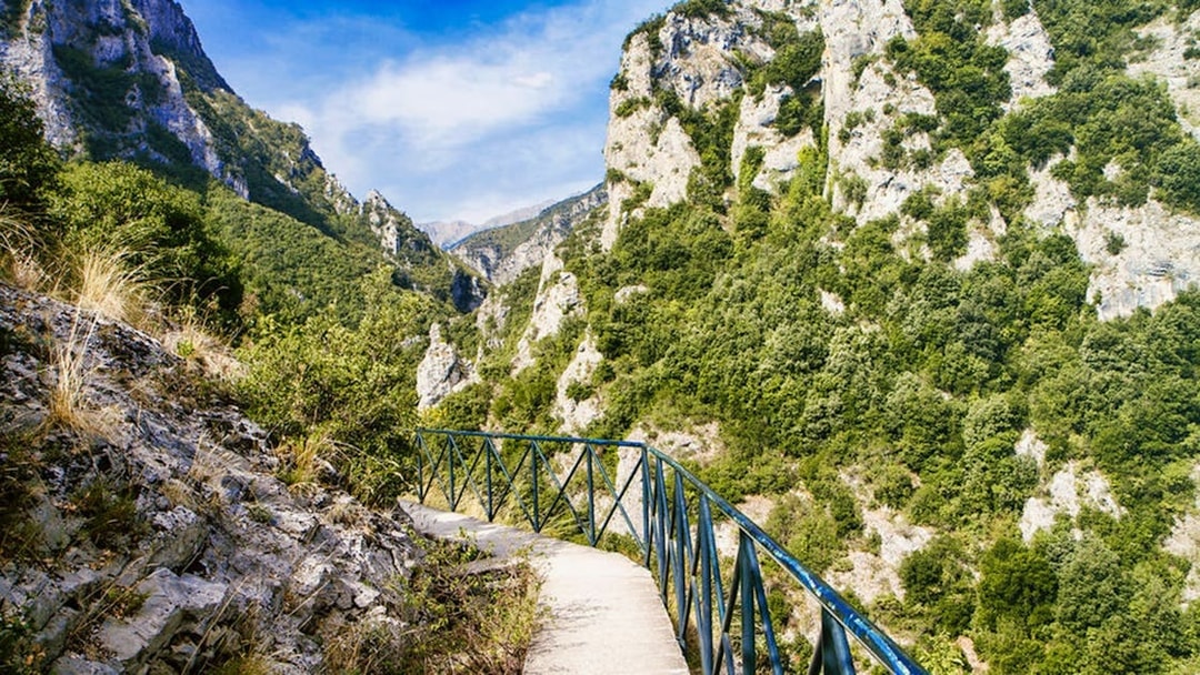 Pathway through lush green mountains at Mount Olympus, Greece.