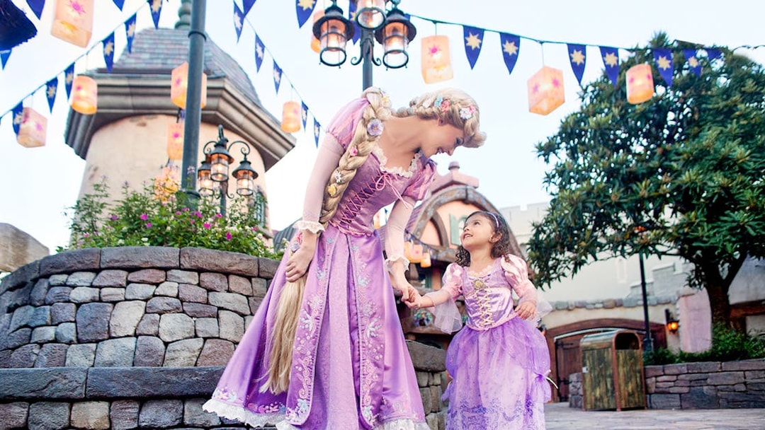 Princess and child in purple dresses at Disney's Hollywood Studios, Orlando.
