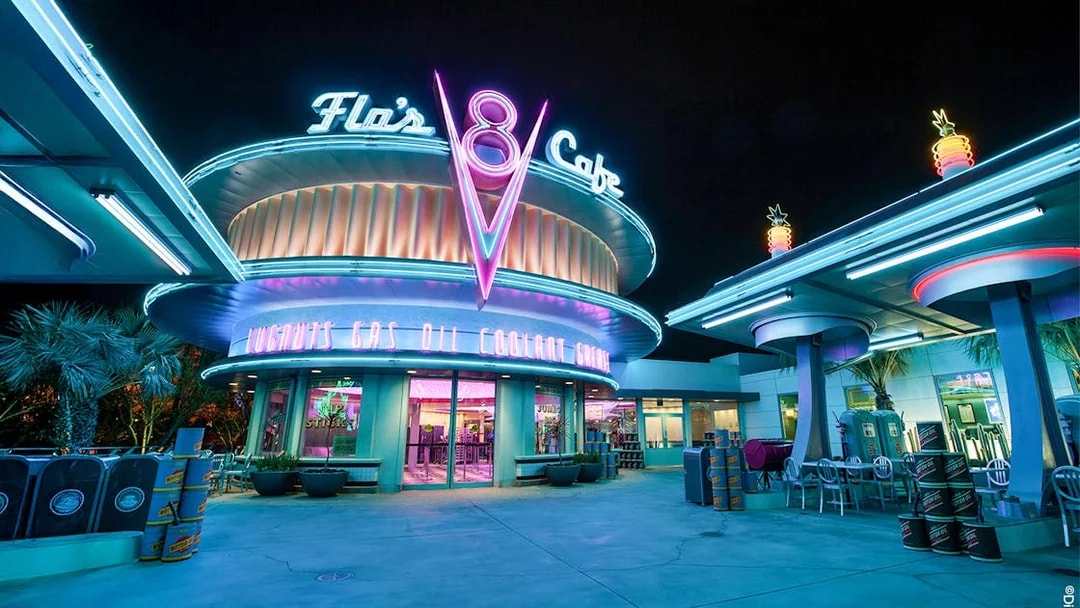 Flo's Cafe neon-lit exterior at Disneyland Adventure Park, California.