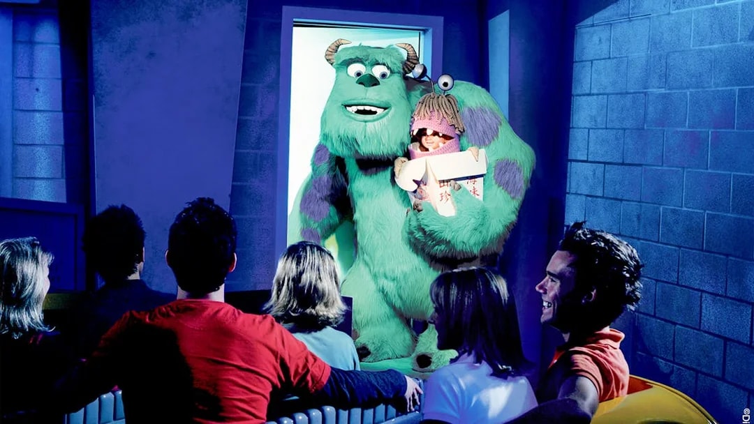 Guests on the Monster's Inc. ride at Disneyland Adventure Park California see Sulley holding Boo.
