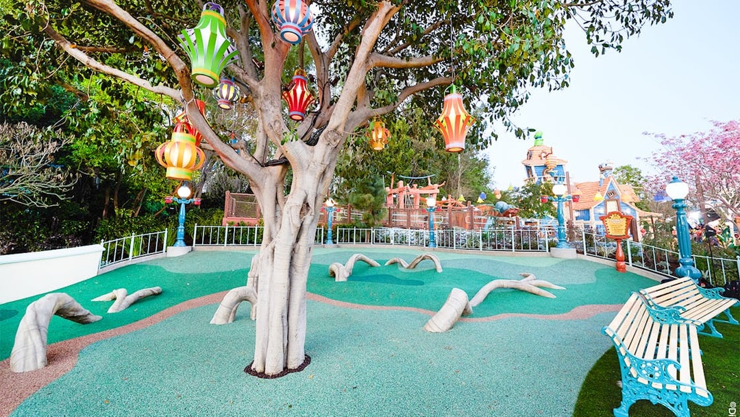 Colorful lanterns hanging from a tree in CenToonial Park, Disneyland Park California.