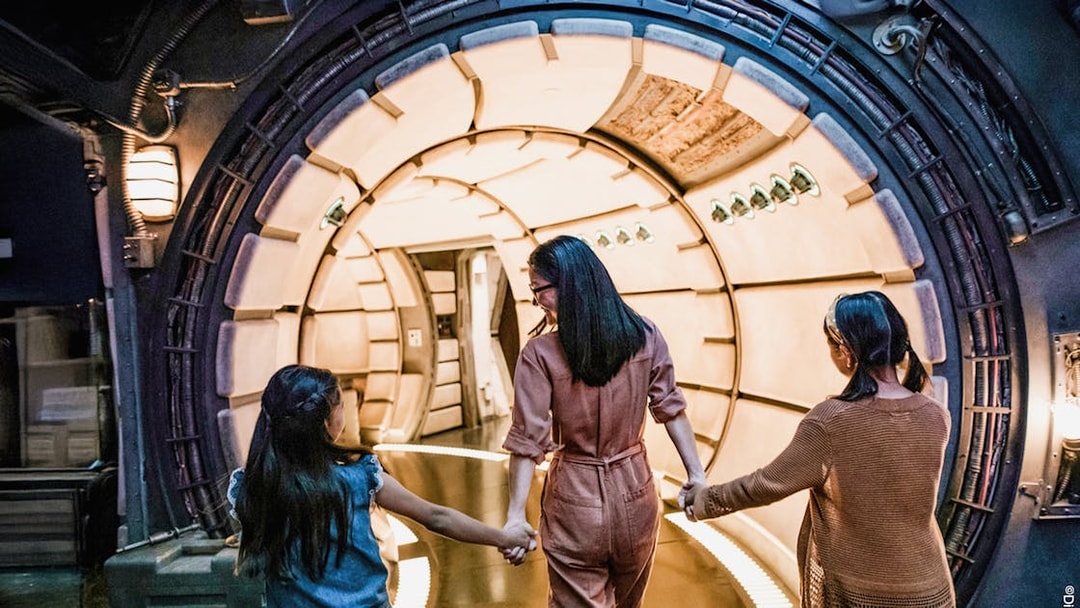 Guests entering Star Wars-themed tunnel at Disneyland Adventure Park, California.