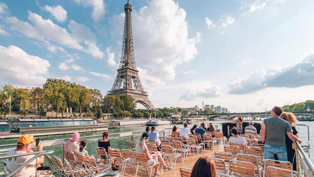 Sightseeing cruise on the Seine River with view of the Eiffel Tower in Paris.