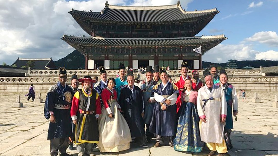 Tour group in Hanbok at Gyeongbokgung Palace, Seoul, South Korea.
