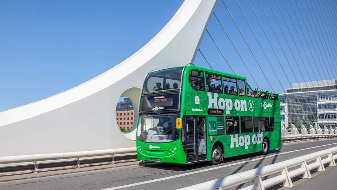 Dublin hop-on hop-off bus crossing Samuel Beckett Bridge.