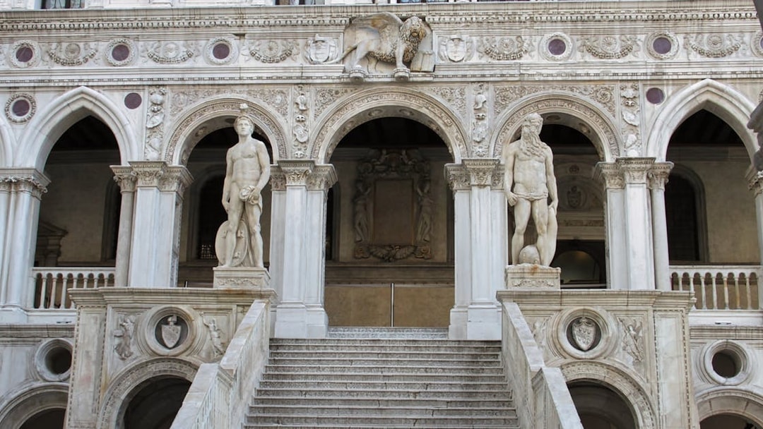 Doge's Palace staircase with statues in Venice, Italy.