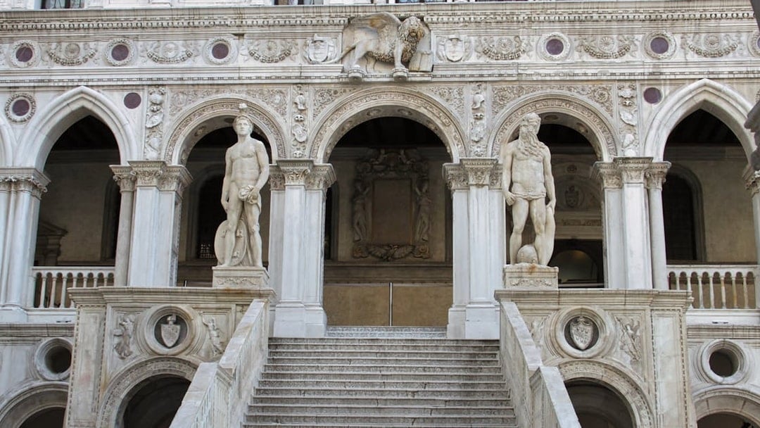 Doge's Palace staircase with statues in Venice, Italy.