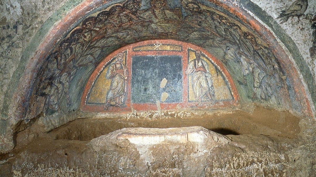 Wall paintings depicting biblical figures in the Catacombs of Domitilla, Rome.