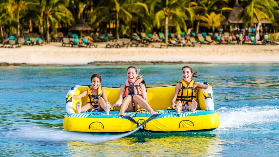 Women enjoying a water donut ride in Dubai.