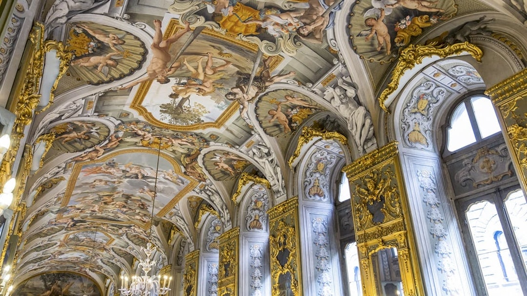 Doria Pamphilj Gallery ceiling frescoes with intricate gold detailing and classical figures.