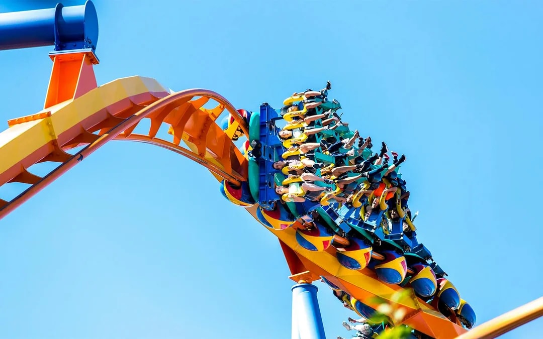 Talon roller coaster at Dorney Park, riders upside down on a loop.