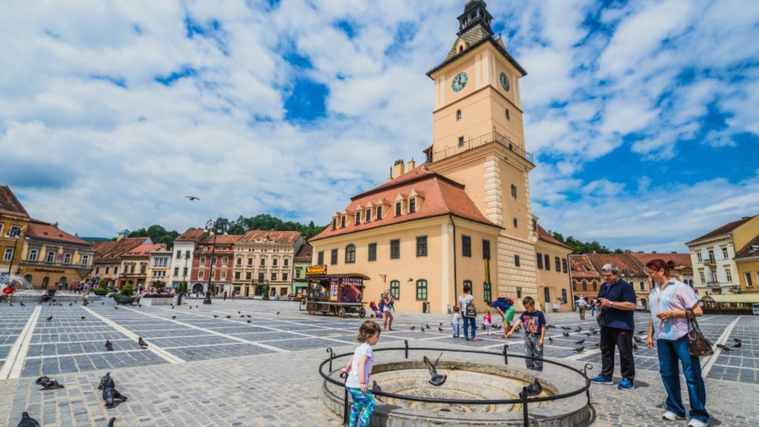 Brașov Council Square with Black Church in background, part of Dracula's life journey tour.