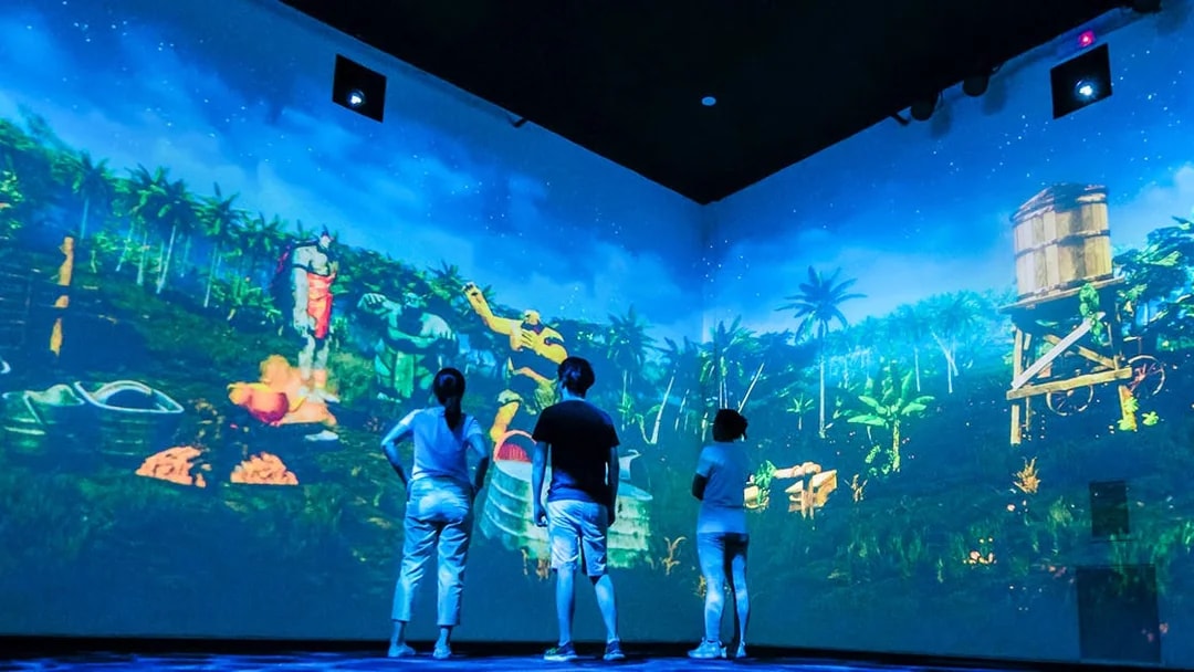 Visitors experience local legends through projection mapping in an immersive room.